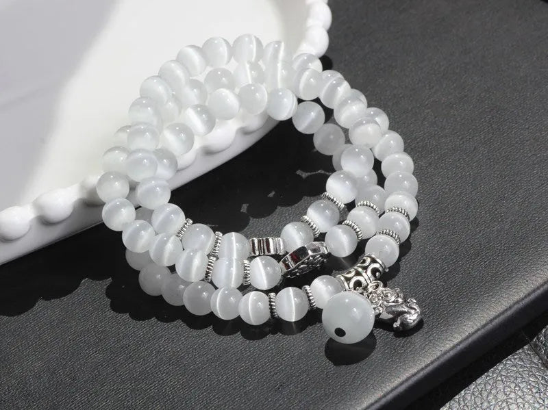 Women's opal crystal bracelet with lucky cat charm and geometric design, shown in blue colour option