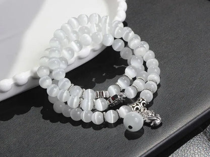 Women's opal crystal bracelet with lucky cat charm and geometric design, shown in blue colour option