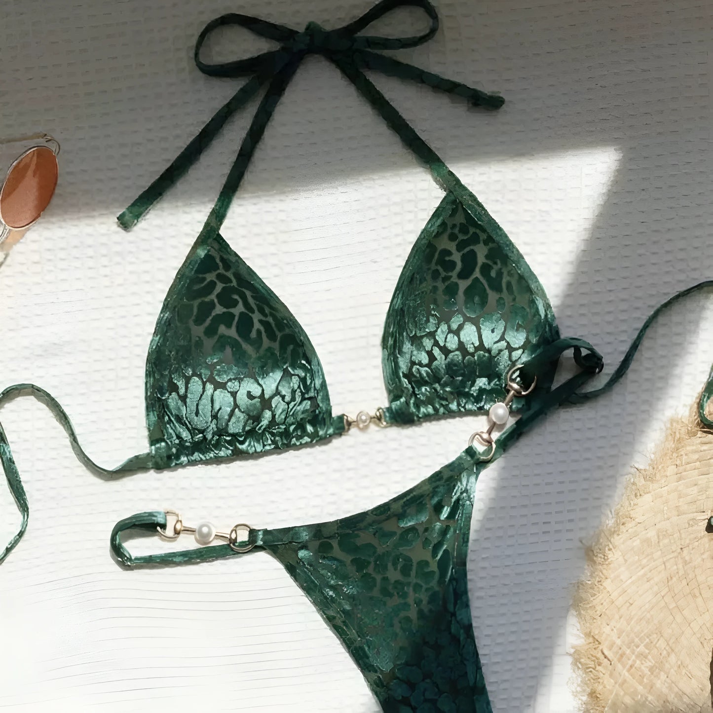 Women's blue leopard print T-shaped bikini set for swimming on a mannequin.