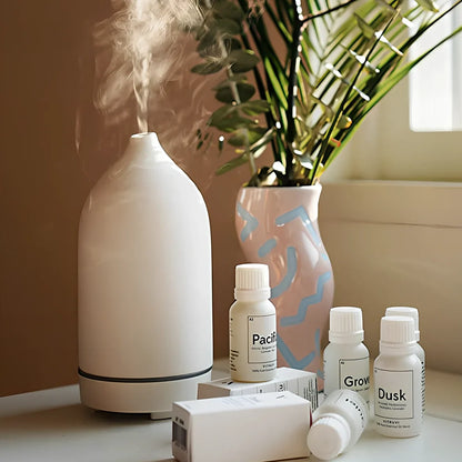 Ceramic ultrasonic aroma diffuser in white with 100ml tank, diffusing mist in home setting, 10cm diameter