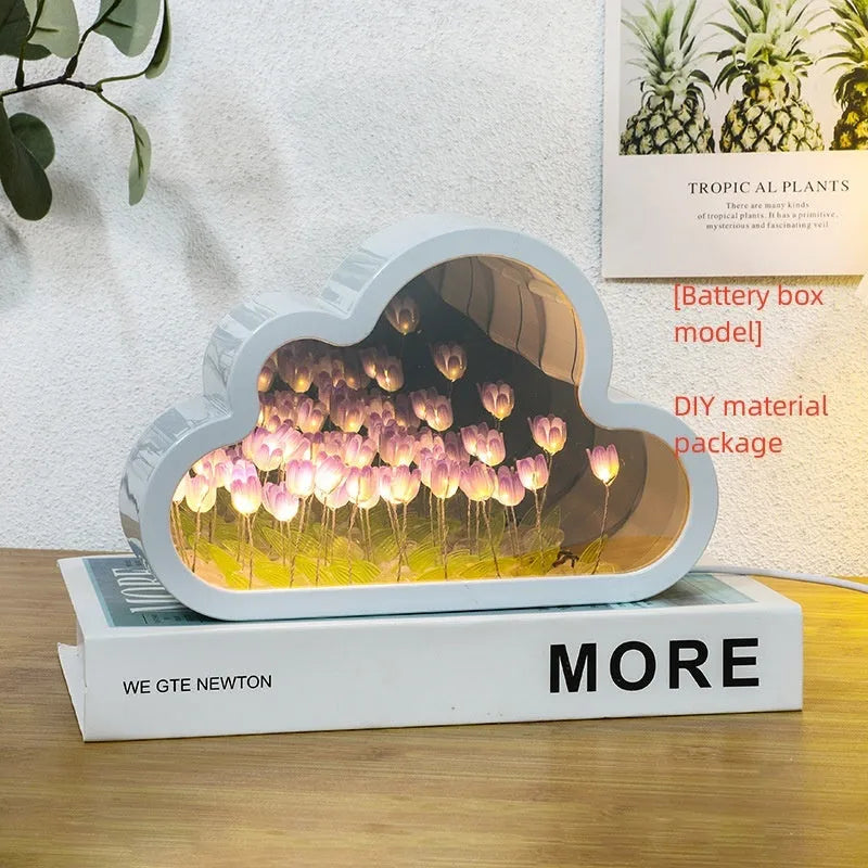 DIY tulip-shaped night lamp kit with LED lights and mirror surface in assorted colours on a desk.