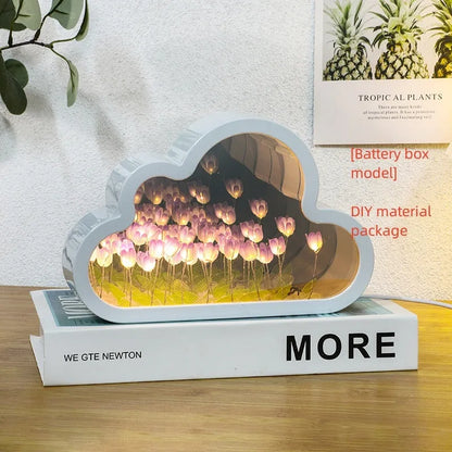 DIY tulip-shaped night lamp kit with LED lights and mirror surface in assorted colours on a desk.