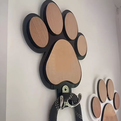 Black and white wooden paw print shaped wall hook for hanging keys or coats