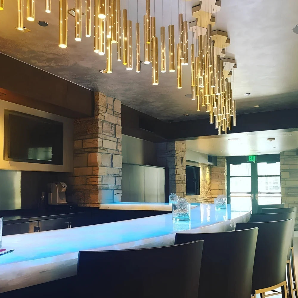 Carved hollow tube bar chandelier with six LED heads in aluminium alloy construction measuring 120cm length