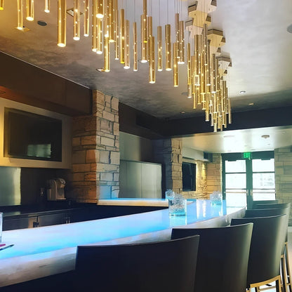 Carved hollow tube bar chandelier with six LED heads in aluminium alloy construction measuring 120cm length