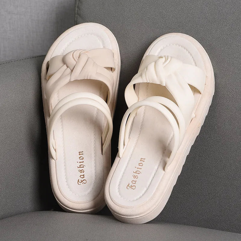 Women's black PVC sandals with thick soft back, floral detail, and injection moulded sole