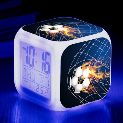 Colourful cartoon football pattern children's mute alarm clock on a table.