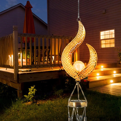 Solar wrought iron wind chime lamp with hollow flame design for garden lighting