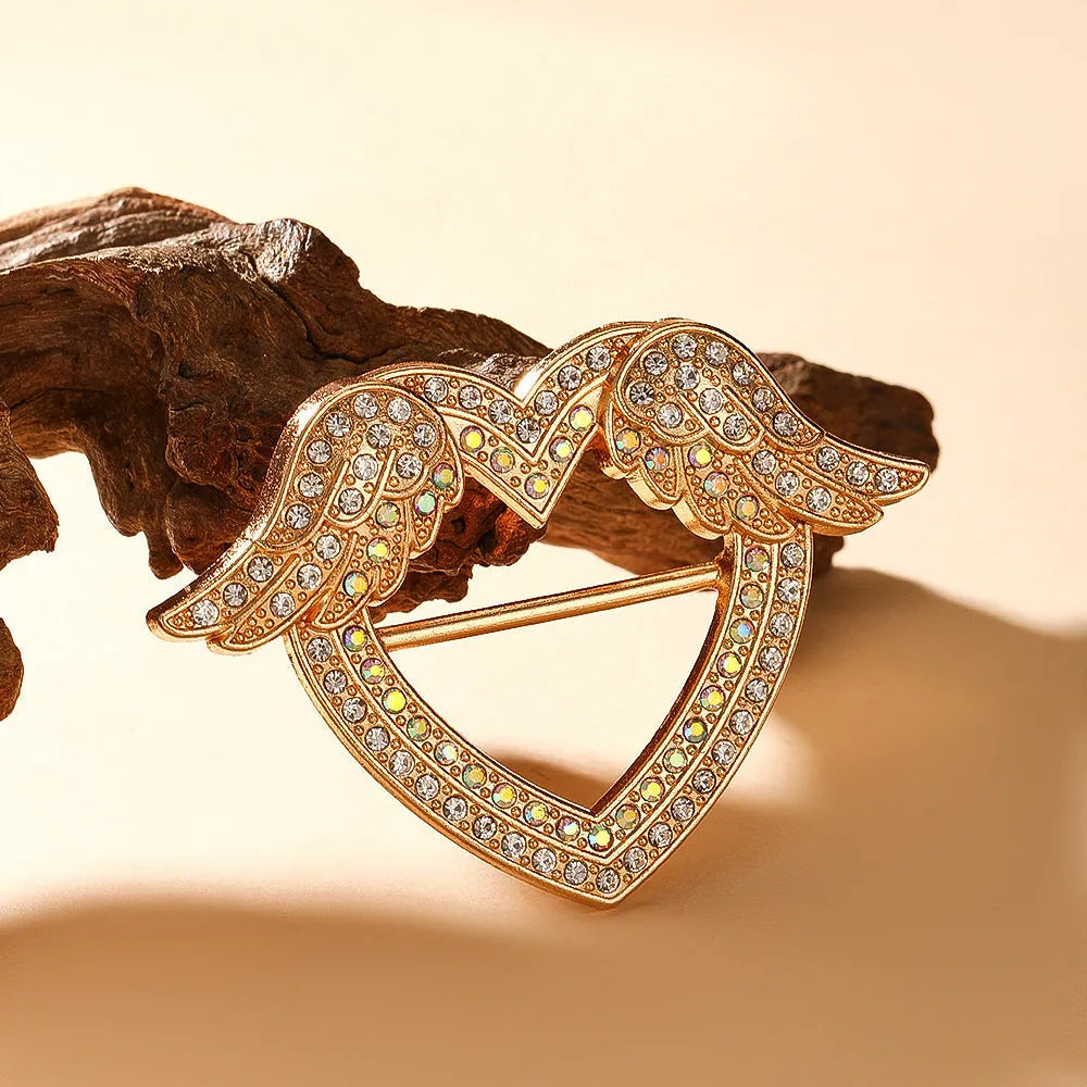 Bow-shaped waist-cinching accessory clip for high-end brooches, alloy with electroplating and diamond inlay, shown in gold, silver, or rose gold finishes.