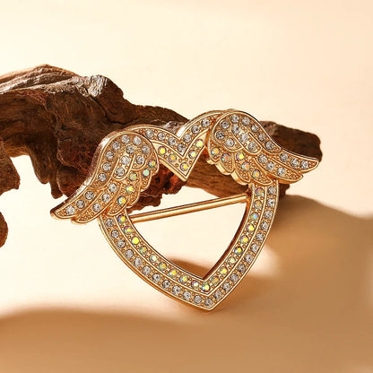 Bow-shaped waist-cinching accessory clip for high-end brooches, alloy with electroplating and diamond inlay, shown in gold, silver, or rose gold finishes.