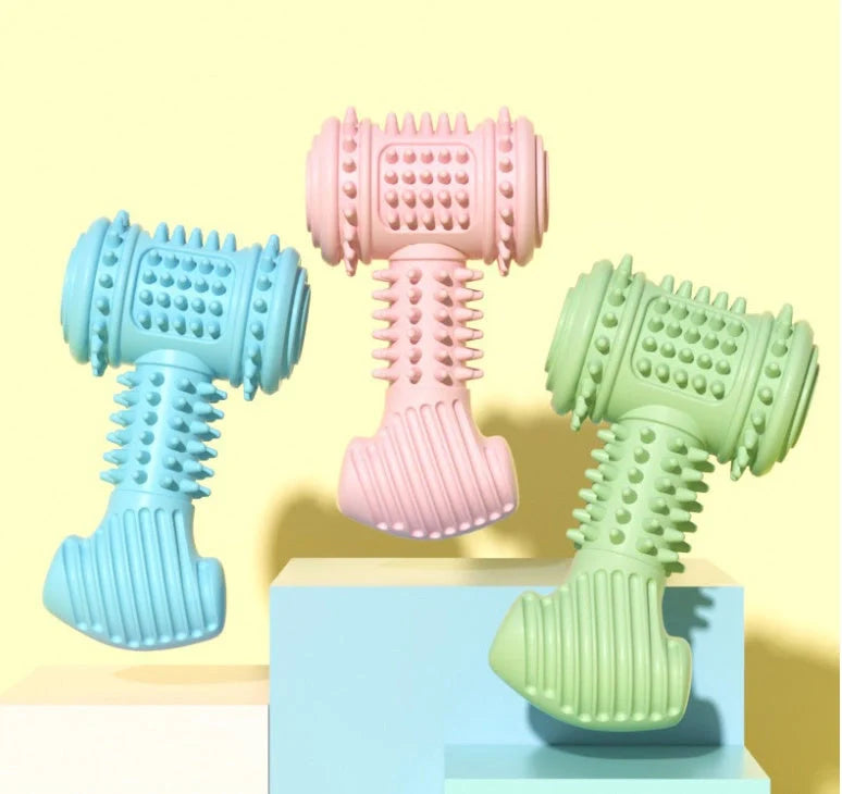 Indestructible TPR dog chew toy in blue, pink, and green for teeth cleaning and anxiety relief