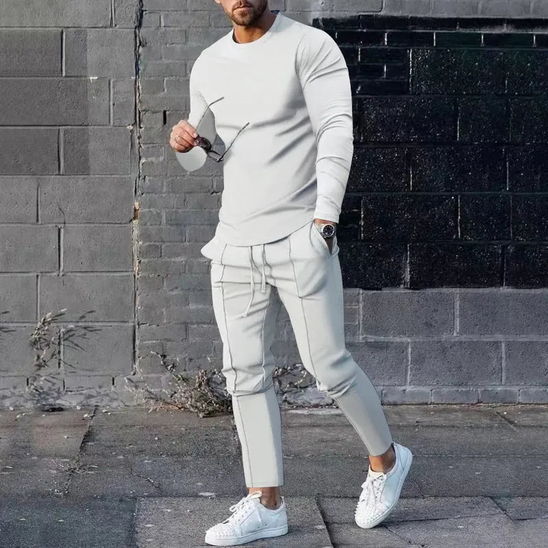 Men's light grey polyester two-piece suit set with long sleeve round neck T-shirt and matching trousers.