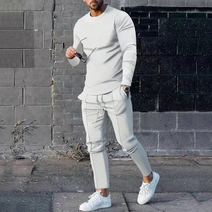 Men's light grey polyester two-piece suit set with long sleeve round neck T-shirt and matching trousers.
