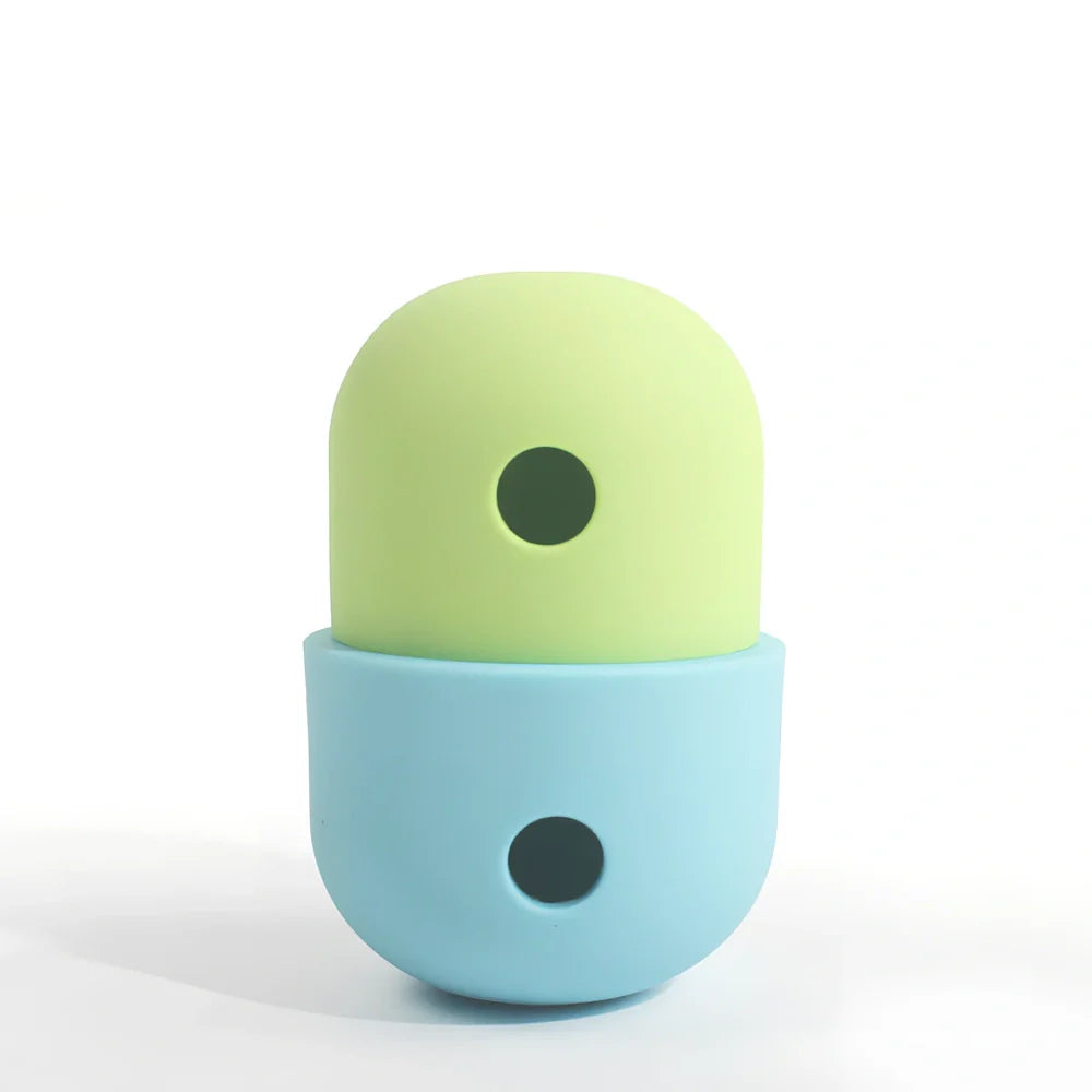 Yellow and blue silicone dog toy ball with treat opening for medium to large breed dogs