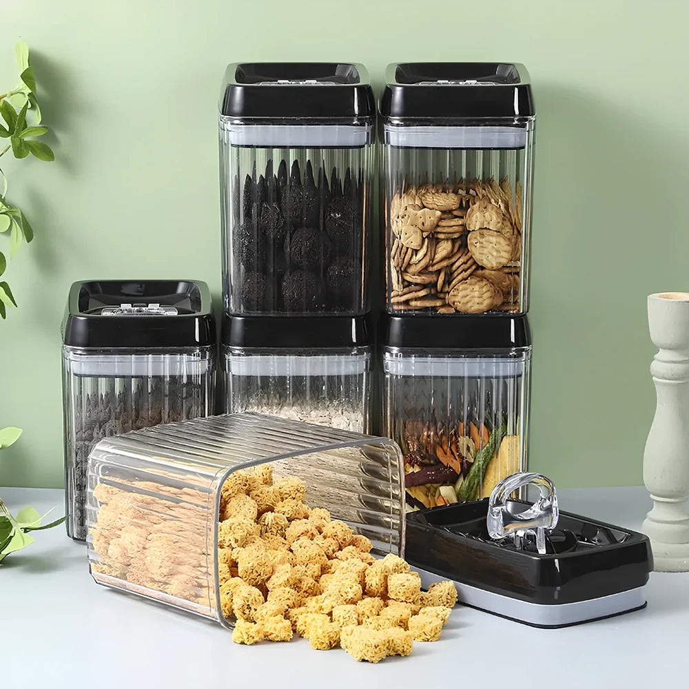 Six black food storage containers with lids in two sizes: two large 3.3-litre and four smaller 1.5-litre jars