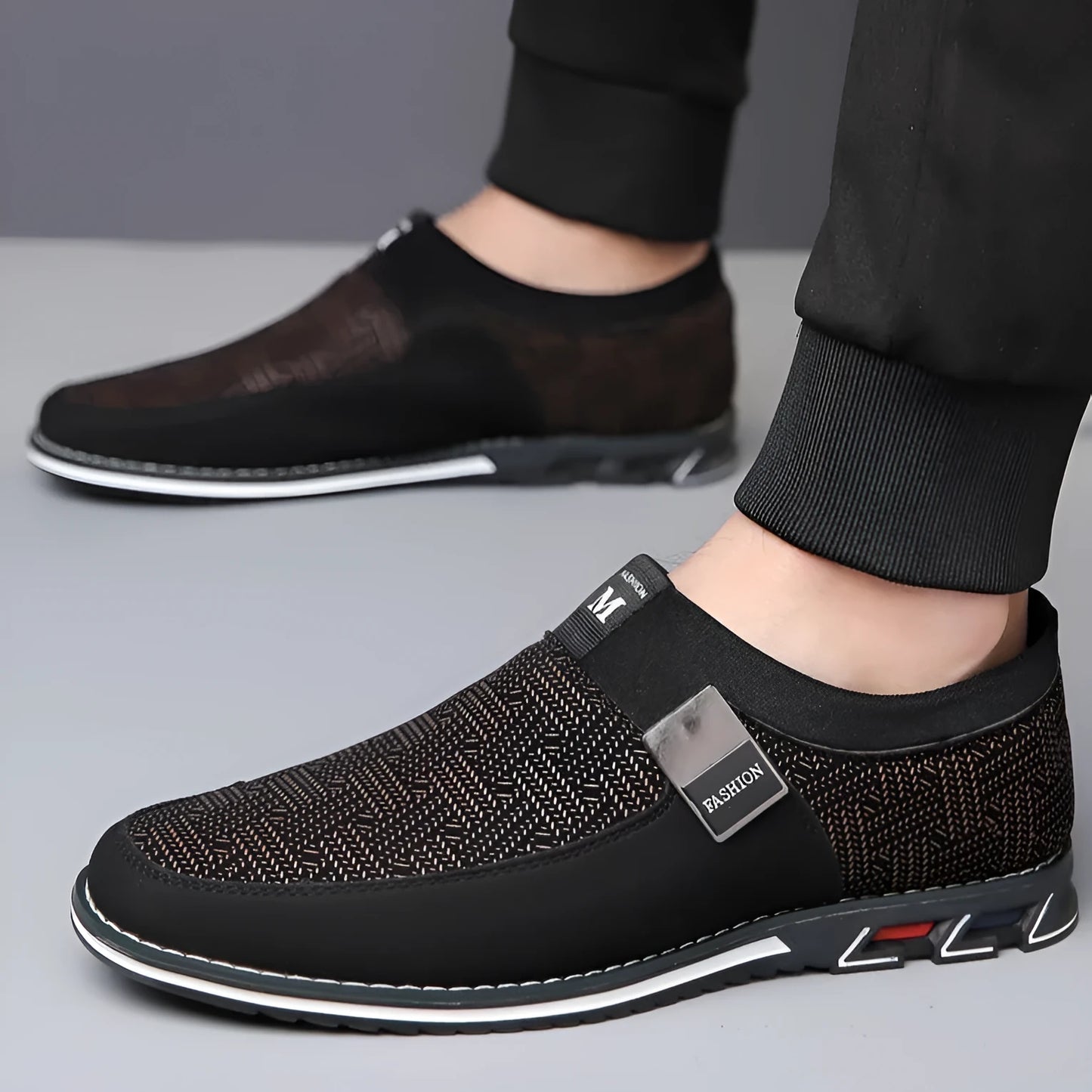 Men's grey and white synthetic leather casual shoes with square toe and flat rubber sole.
