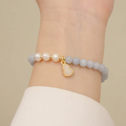 Gold plated women's bracelet with artificial crystal aquamarine chalcedony pendant in climbing cat design