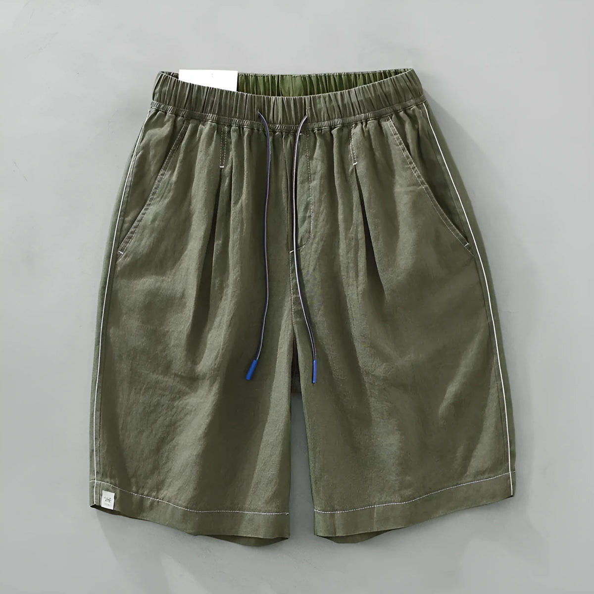 Men's solid colour linen shorts in loose straight drooping style on hanger
