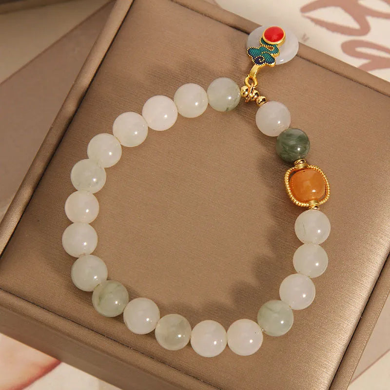 Ice jade crystal bracelet for women with Xiangyun peace jade buckle and pearl accents.