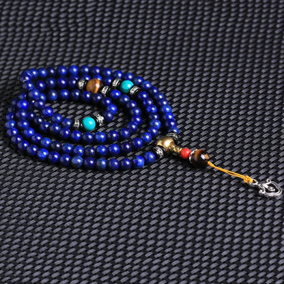 Natural lapis lazuli 108 bead bracelet with zodiac animal modelling in blue stone with gold flecks