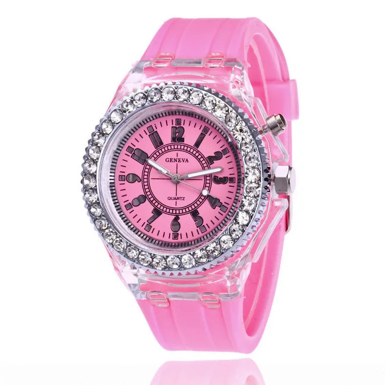 Women's LED luminous quartz watch with silicone strap and round alloy case on wrist