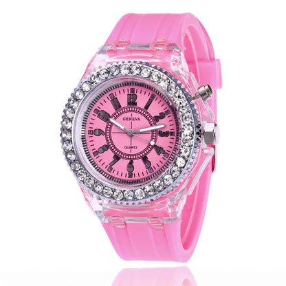 Women's LED luminous quartz watch with silicone strap and round alloy case on wrist