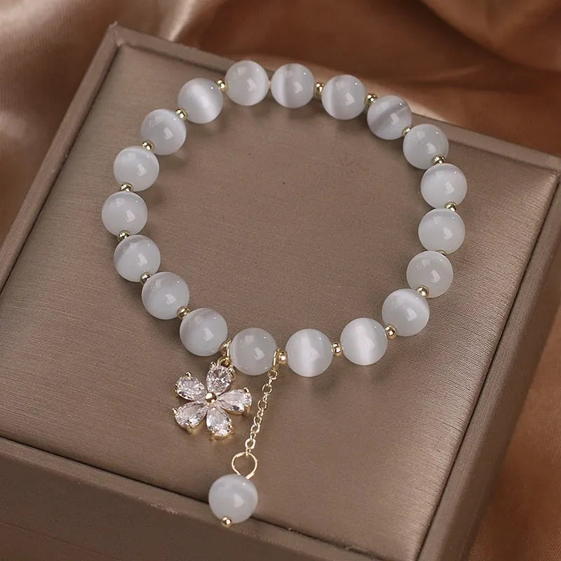 White cat's eye crystal women's bracelet with floral tassels and adjustable safety buckle clasp