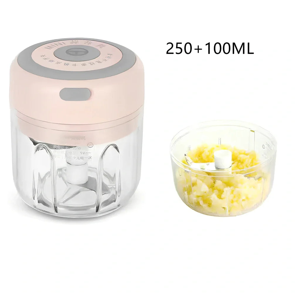 Mini electric garlic chopper with stainless steel blades in green, pink, or white with USB charging cable