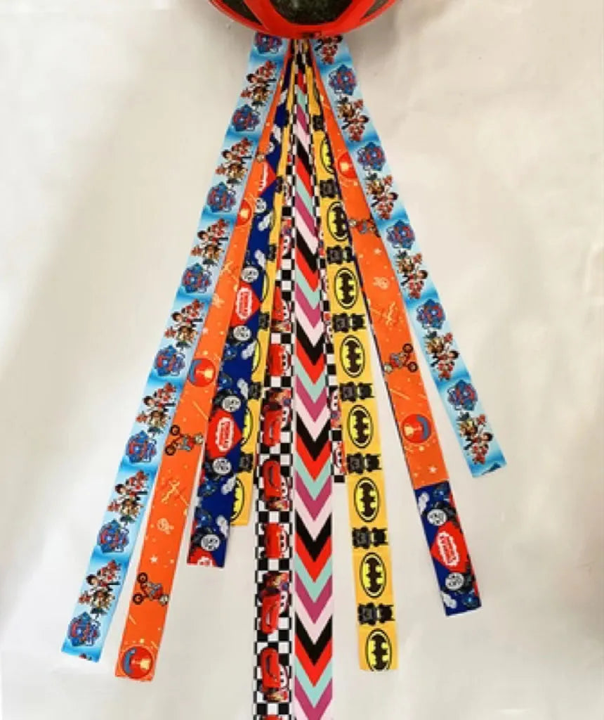Children's helmet streamer with 60 cm polyester ribbon in colours like apricot and khaki for roller skating and skiing