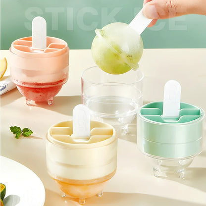 Four colourful lollipop-shaped silicone ice moulds showing creamy yellow, pink, blue, and yellow options