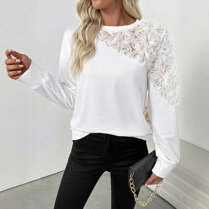 White long sleeve top with floral pattern, loose fit, regular sleeves, pullover style