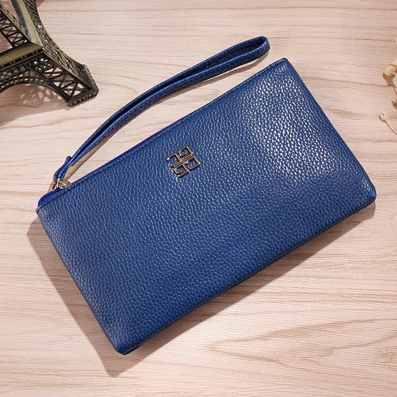 Long 55 cm PU leather wallet handbag in wine red colour with zipper closure open showing interior phone pocket and card slots