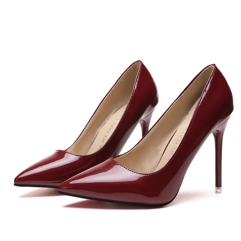 Women's pointed toe stiletto high heel pump in apricot colour with buckle detail.