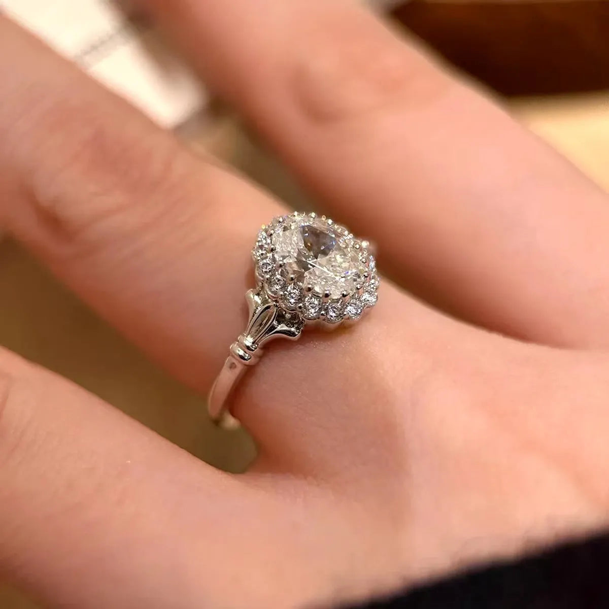 Silver colour geometric ellipse ring with adjustable opening and diamond-treated surface