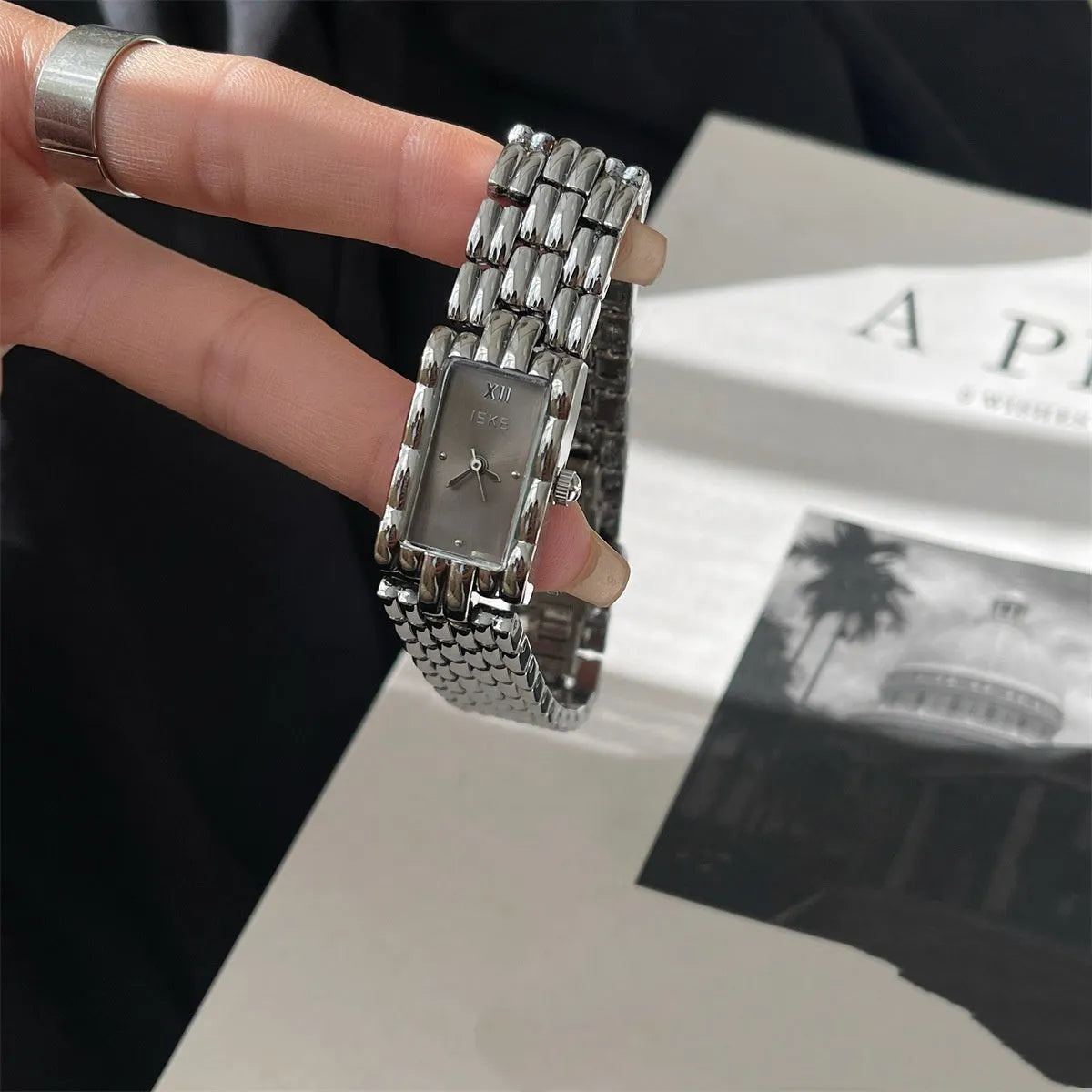 Bracelet-style women's watch with 15mm dial, 7mm thickness, mineral glass, and butterfly buckle in silver or gold.