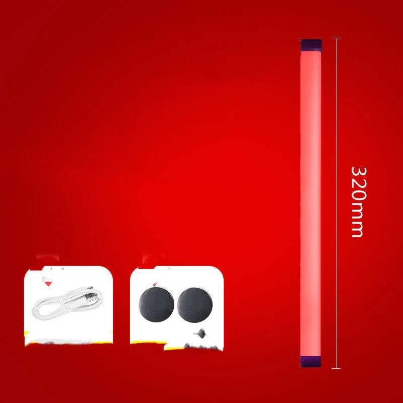 Blue rechargeable LED light tube with USB plug and push-button switch on a dark surface