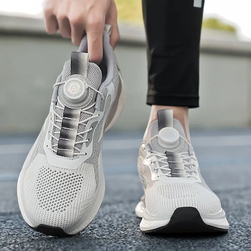Men's low-top white running shoe with a rotating buckle closure and mesh upper.