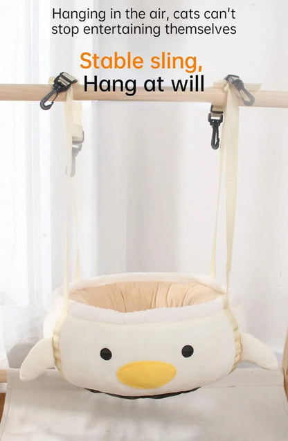 Green chick-shaped cat bed laid flat with hanging straps attached, suitable for small cats