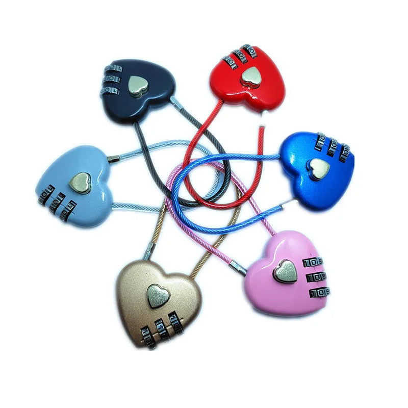 Peach heart-shaped ABS plastic bicycle helmet lock with a long steel cable, shown in various colours.