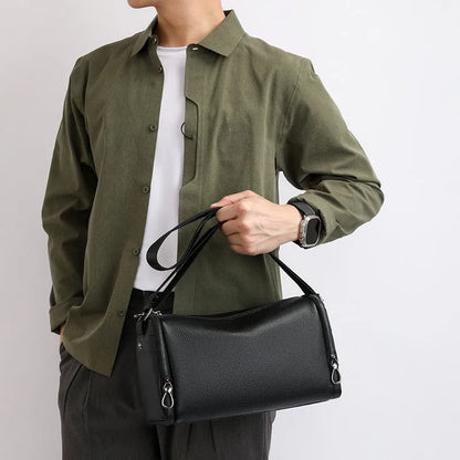 Genuine leather crossbody shoulder bag for men in black or brown with top grain cowhide and stitching detail