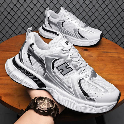 Men's white and grey mesh running shoes with round toe and plastic sole.