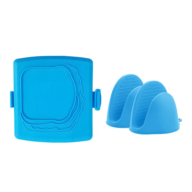 Red silicone baking tray with handbag-shaped mould and matching heat-resistant gloves on kitchen counter
