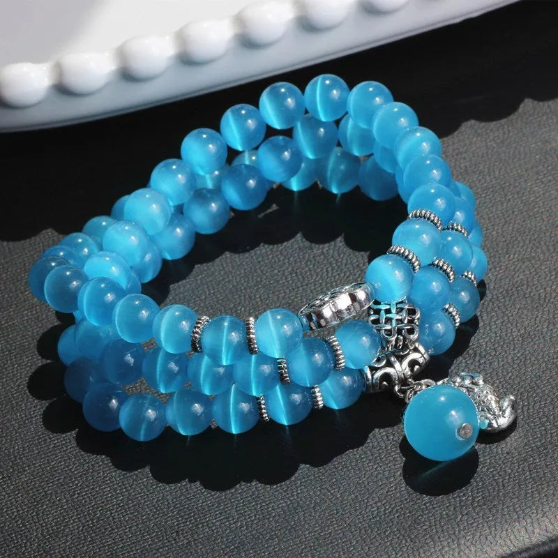 Women's opal crystal bracelet with lucky cat charm and geometric design, shown in blue colour option