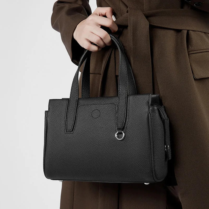 Genuine leather crossbody bag with square shape and adjustable shoulder strap