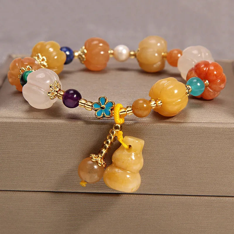 Women's yellow agate crystal bracelet on gold silk cord with Japanese style design