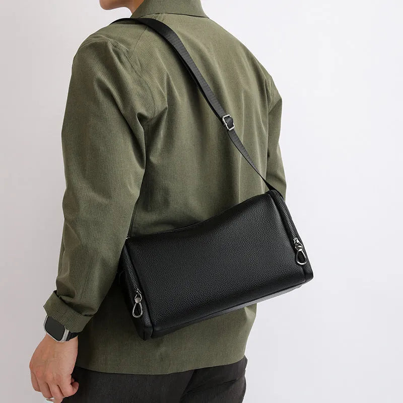 Genuine leather crossbody shoulder bag for men in black or brown with top grain cowhide and stitching detail