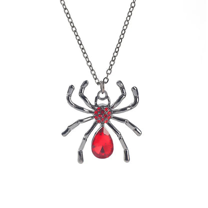 Gothic style zinc alloy necklace with bat pendant on a silver chain against dark background.