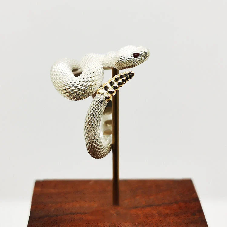 Adjustable snake ring with unique rattlesnake design in various color options, including white and black with open or shut mouth styles, and gold accents