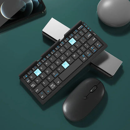 Silver white folding Bluetooth keyboard with stand holding tablet, showing compact folded size