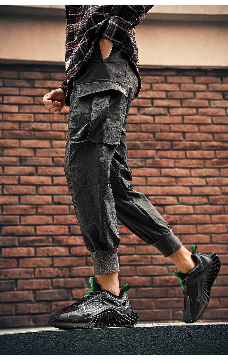 Large size blade men's running shoes with hollow out design in white, black, and blue orange